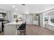Spacious kitchen with quartz countertops, stainless steel appliances, barstool seating, and a dining nook at 13619 Lake Ave, Brighton, CO 80603