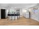 Open kitchen and laundry area features an island, stainless steel appliances, and ample cabinet space at 13619 Lake Ave, Brighton, CO 80603