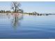 Beautiful lake view with kayaks and paddle boards, perfect for enjoying water activities and outdoor recreation at 13619 Lake Ave, Brighton, CO 80603