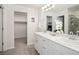 Bright bathroom features double sinks, modern fixtures, and walk-in shower and a walk-in closet at 11228 Bella Vita Dr, Broomfield, CO 80020