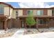 Attractive townhome featuring a stone facade, covered porch, and low maintenance landscaping with neutral color palettes at 11228 Bella Vita Dr, Broomfield, CO 80020