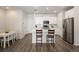 Bright kitchen features an island with bar seating, stainless appliances, and plenty of cabinet space at 11228 Bella Vita Dr, Broomfield, CO 80020