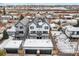 Birds eye view of townhomes with garages surrounded by a charming neighborhood in winter at 2321 S Galapago St, Denver, CO 80223