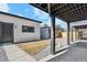 Backyard with concrete patio and gravel, featuring detached garages/accessory dwelling unit at 2321 S Galapago St, Denver, CO 80223