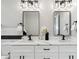 Bathroom featuring double sink, granite countertops, and modern lighting at 2321 S Galapago St, Denver, CO 80223