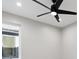 Bright bedroom with a black ceiling fan, recessed lighting, and a large window at 2321 S Galapago St, Denver, CO 80223