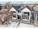 Stylish two-story townhome with balconies, black accents, and fresh landscaping at 2321 S Galapago St, Denver, CO 80223