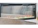 Modern fireplace featuring decorative glass stones and a cozy ambiance at 2321 S Galapago St, Denver, CO 80223