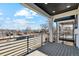 Large front deck with metal railings and view of the street and neighborhood at 2321 S Galapago St, Denver, CO 80223