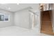 Bright living room with a staircase, neutral walls, recessed lighting, and light flooring at 2321 S Galapago St, Denver, CO 80223