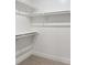 Empty walk-in closet with shelving and neutral carpeting, ready for personalization at 2321 S Galapago St, Denver, CO 80223