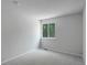 A cozy bedroom with carpeted floors and a window bringing in natural light at 5163 E 123Rd Ct, Thornton, CO 80241