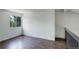 Bright bedroom features hardwood floors and a window with natural light at 5163 E 123Rd Ct, Thornton, CO 80241