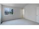 Cozy bedroom with vaulted ceilings and neutral carpets featuring a large window at 5163 E 123Rd Ct, Thornton, CO 80241