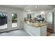 Modern kitchen with a breakfast bar, stainless steel appliances, and ample cabinet space at 5163 E 123Rd Ct, Thornton, CO 80241