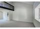 A spacious living room featuring a lofted area and large windows at 5163 E 123Rd Ct, Thornton, CO 80241