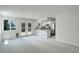 Open living space with a modern kitchen and access to the backyard at 5163 E 123Rd Ct, Thornton, CO 80241