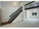 Bright, open living room with a staircase and large window at 5163 E 123Rd Ct, Thornton, CO 80241