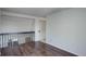 Hardwood floors in the upstairs landing with a view of the living space below at 5163 E 123Rd Ct, Thornton, CO 80241