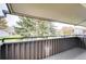 Private balcony with views of trees and neighboring buildings at 7110 S Gaylord St # L7, Centennial, CO 80122