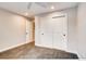 Neutral bedroom featuring plush carpet, closet with sliding doors, and ceiling fan at 7110 S Gaylord St # L7, Centennial, CO 80122