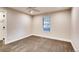 Bedroom with carpet and a window at 7110 S Gaylord St # L7, Centennial, CO 80122