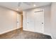 Neutral bedroom featuring plush carpet, closet with sliding doors, and ceiling fan at 7110 S Gaylord St # L7, Centennial, CO 80122