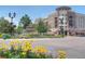 Beautiful community roundabout with vibrant flowers, landscaping, and fountain at 7110 S Gaylord St # L7, Centennial, CO 80122