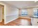 Bright dining area with a large window and wood-look floors at 7110 S Gaylord St # L7, Centennial, CO 80122