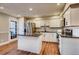 Well-lit kitchen featuring a modern island and stainless steel appliances at 7110 S Gaylord St # L7, Centennial, CO 80122