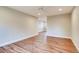 Open living room with hardwood floors and a ceiling fan at 7110 S Gaylord St # L7, Centennial, CO 80122