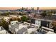 Aerial view of modern townhomes with rooftop patios and a beautiful city skyline at 3131 Vallejo St, Denver, CO 80211
