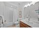 Bright bathroom featuring a shower-tub combo, white tile, and modern fixtures at 3131 Vallejo St, Denver, CO 80211