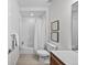 Clean bathroom with a shower-tub combo, modern fixtures, and a wood vanity at 3131 Vallejo St, Denver, CO 80211