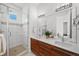Bathroom with double vanity, modern fixtures, and a glass-enclosed shower at 3131 Vallejo St, Denver, CO 80211