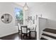 Elegant dining room with modern lighting, stylish table setting, and large windows offering scenic views at 3131 Vallejo St, Denver, CO 80211