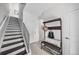 Entryway with staircase, bench, coat rack, and tiled flooring at 3131 Vallejo St, Denver, CO 80211