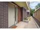 Modern townhome exterior with brick and wood accents, featuring a welcoming front entrance at 3131 Vallejo St, Denver, CO 80211