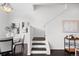 Hallway featuring artwork, elegant decor, and stairs, creating a sophisticated and inviting atmosphere at 3131 Vallejo St, Denver, CO 80211