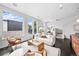Spacious living room with ample natural light, stylish furnishings, and a seamless flow to the dining area at 3131 Vallejo St, Denver, CO 80211