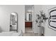 View from the main bedroom showing an en suite bathroom, modern decor and tiled floors at 3131 Vallejo St, Denver, CO 80211