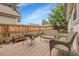 Backyard deck with outdoor seating area, perfect for relaxing and entertaining at 17499 E Whitaker Dr, Aurora, CO 80015