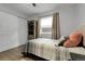 Bedroom with wood flooring, closet, and an accent pillow and a ceiling fan at 17499 E Whitaker Dr, Aurora, CO 80015