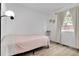 Simple bedroom with wood flooring and natural light from a window at 17499 E Whitaker Dr, Aurora, CO 80015