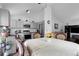 Open-concept kitchen and dining area with modern appliances and ample cabinet space at 17499 E Whitaker Dr, Aurora, CO 80015