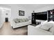 Bright living room featuring sleek laminate floors, neutral walls and furniture, and ample natural light at 17499 E Whitaker Dr, Aurora, CO 80015