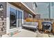 Cozy back patio features a grill, seating, and sliding door access at 1035 Milo Cir # B, Lafayette, CO 80026