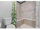Upgraded shower with stone pattern tile and seat at 1035 Milo Cir # B, Lafayette, CO 80026
