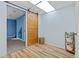 Bonus room with unique sliding barn door, storage shelf and nearby bedroom at 1035 Milo Cir # B, Lafayette, CO 80026