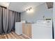 Laundry room with newer washer and dryer, sink and folding area at 1035 Milo Cir # B, Lafayette, CO 80026